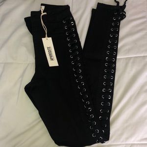 Black high waisted jeans with side tie detail